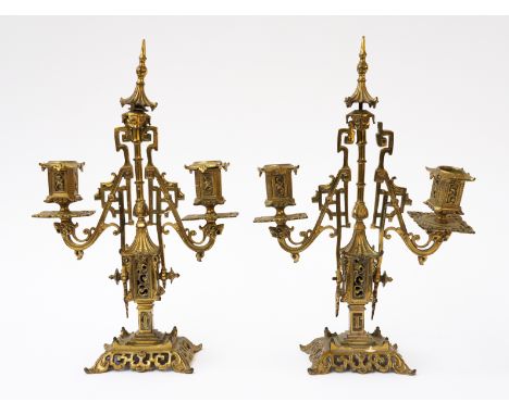 A PAIR OF CHINOISERIE STYLE BRASS TWIN LIGHT CANDELABRA (2)Late 19th Century
With pagoda finials and pierced fret work, 34cm 