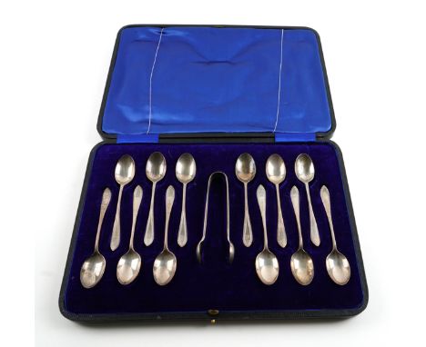 A SET OF TWELVE SILVER COFFEE SPOONS AND A SIMILAR PAIR OF SUGAR TONGSFeather edged Old English pattern, engraved with the in