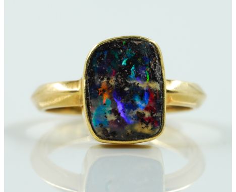 A GOLD AND BOULDER OPAL RINGCollet set with the bolder opal, unmarked, ring size S, gross weight 5.2 gmsCondition Report; Siz