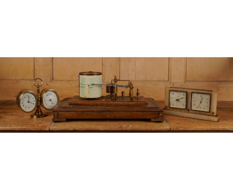 AN EDWARDIAN MAHOGANY CASED BAROGRAPH BY NEGRETTI & ZAMBRA, TOGTHER WITH TWO DESK BAROMETERS (3)Early 20th Century
The barogr