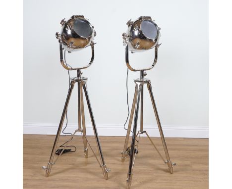 A PAIR OF CHROME-PLATED FLOOR STANDING SPOT LIGHT LAMPS (2)Recent Manufacture 
Mounted on height adjustable tripod bases, the