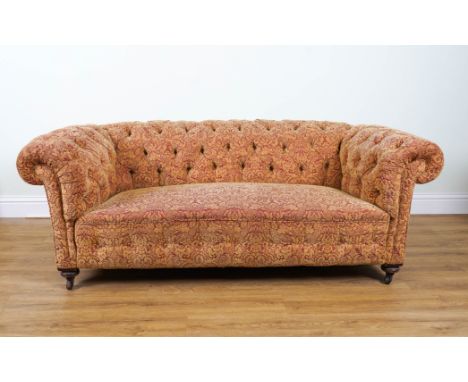 A VICTORIAN MAHOGANY FRAMED CHESTERFIELD SOFAPossibly by Waring and Gillow, on turned supports,  190cm wide; 68cm highConditi
