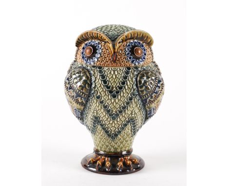 A DOULTON STONEWARE OWL TOBACCO JAR AND COVER (2)Dated 1883
With brown button eyes, its feathers glazed in tones of blue, gre