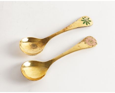TWO GEORG JENSEN SILVER GILT AND ENAMELLED FLORAL SPOONS (2)Comprising 1975 with leaflet and case and 1976, combined weight 8