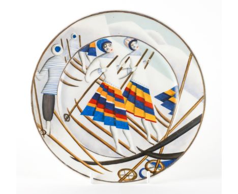 A LATVIAN `BALTARS' PLATEDated 1928
Painted on a Czechoslovakian porcelain blank with female skiers inside a gilt rim, signed