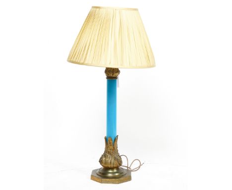 A VICTORIAN GILT-BRASS MOUNTED BLUE OPALINE GLASS TABLE LAMPMid-19th Century
The collar and base of the column cast with Lily