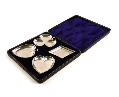 A SET OF FOUR SILVER BRIDGE DISHES (4)Each representing one of four playing card suits, decorated with beaded borders, Birmin