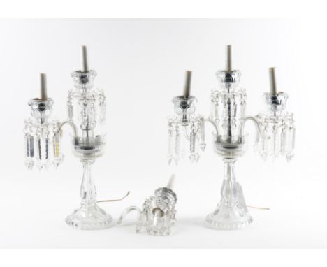 A PAIR OF CUT AND MOULDED GLASS THREE LIGHT TWO BRANCH TABLE CANDELABRA (2)20th Century
With storm shades and facet cut penda