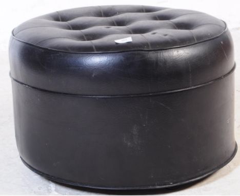 A vintage mid 20th century leatherette vinyl button back footstool / pouffe. Of circular form with button back top in the lea