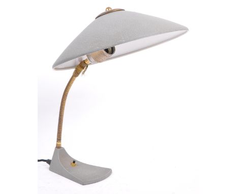 A 1950s brass and stainless steel standard desk lamp light in the manner of Louis Kalff. With swan neck design, UFO domed sha