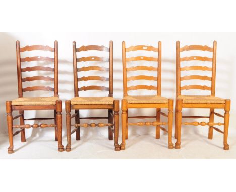 A set of four mid 20th century circa 1940s oak spindle-back, rush-seated dining chairs. Having curved and shaped back rest, d