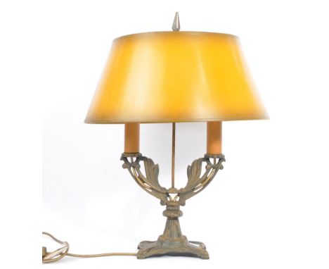 A 20th century French Bouillotte Empire style gilt metal twin arm table lamp. The lamp having twin arms with pierced foliate 