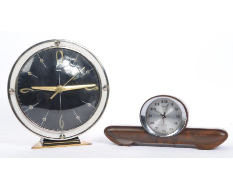 Two vintage mid century alarm clocks by Metamec and Rhythm, Japan.The Metamec example of brass and stainless steel constructi