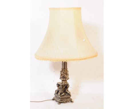 An early 20th century white metal Neo Classical table lamp light. Light fitting to top, tapering reeded central column with f