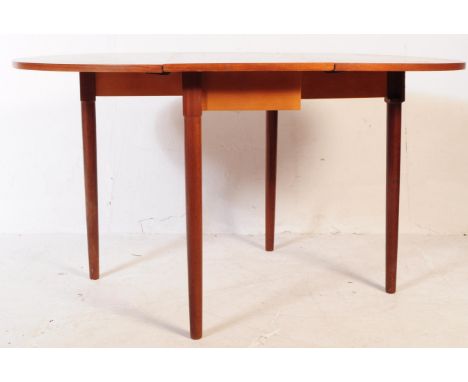 A vintage 20th century drop leaf gate leg space saver dining table. Of rectangular curved form with circular tapering support