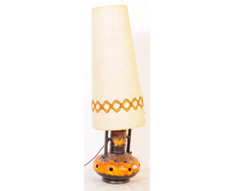 A retro mid 20th century West German ceramic lamp light. Having a pierced lava style body with a large tapering shade. Measur