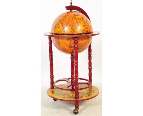 A 20th Century vintage terrestrial mahogany veneer globe drinks cabinet with hinged lid to reveal decanter cocktail cabinet, 