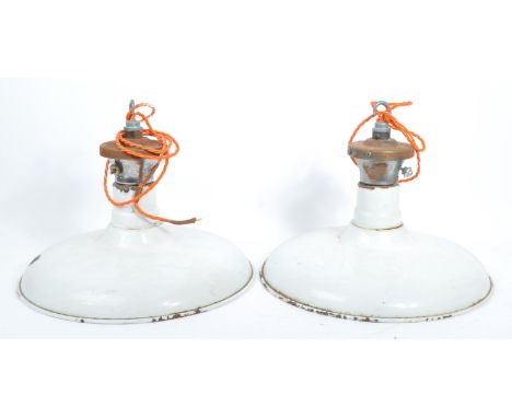 Two retro vintage 1960's industrial factory pendant shades having a white enamel finish with white enamel interior. Single se