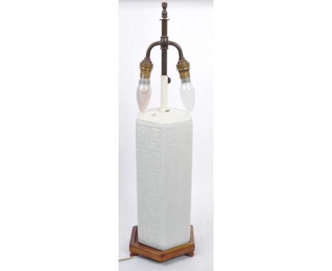 A Chinese porcelain Blanc De Chine lamp decorated with calligraphy characters on hardwood&nbsp;base. Measures approx. 59cm