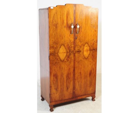A vintage early 20th century circa 1930s Art Deco burr walnut bachelors compact wardrobe free standing closet. Having shaped 