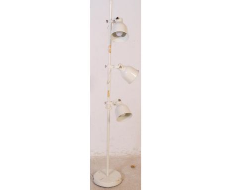 Two mid 20th century floor standing standard light lamp. One of painted white metal construction with adjustable arm and thre