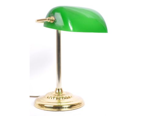 A vintage 20th century 1920's style bronzed and glass bankers lamp by d&auml;r lighting. The lamp having a green cased glass 
