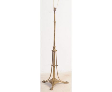 A 19th century Victorian Arts &amp; Crafts&nbsp; brass floor standing lamp / light. With wrought rococo brass base and feet, 