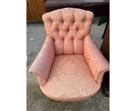 AN EDWARDIAN BUTTON-BACK LOW NURSING CHAIR 