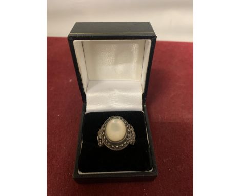 AN OPAL AND MARQUESITE RING IN A PRESENTATION BOX 