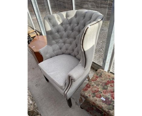 A RACHLIN CLASSICS HIGH BACKED WINGED EASY CHAIR WITH BUTTON BACK 