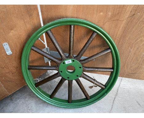 A VINTAGE 'FORD MODEL T VAN' WHEEL WITH METAL RIM AND WOODEN SPOKES 