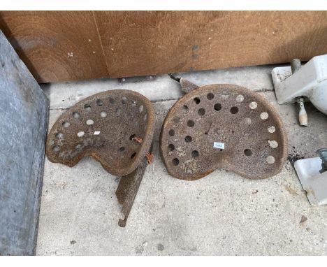A PAIR OF VINTAGE TRACTOR SEATS 
