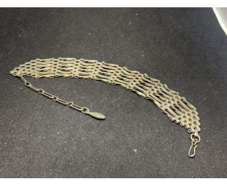 A SILVER SIX BAR GATE BRACELET 