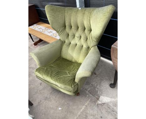 A 1970'S GREEN RETRO BUTTON-BACK SWIVEL EASY CHAIR 
