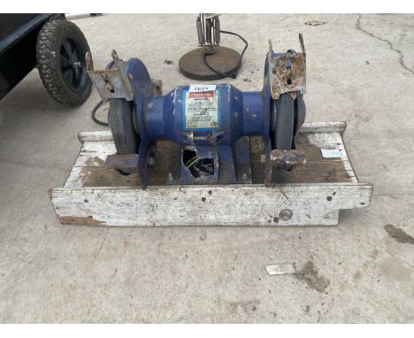 AN ELECTRIC BENCH GRINDER 