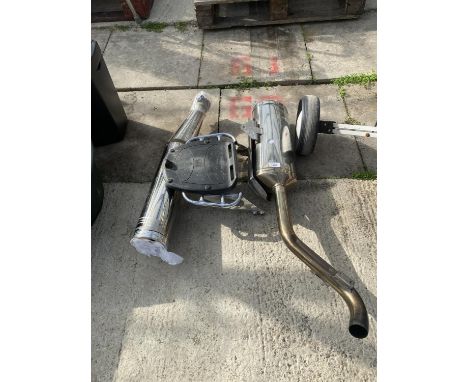 A TRIUMPH EXHAUST PIPE AND FURTHER MOTOR SPARES 