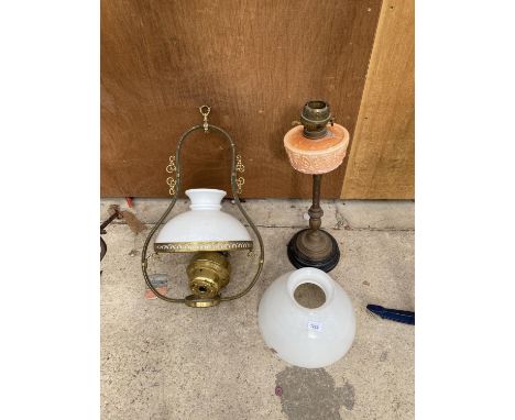 A VINTAGE OIL LAMP AND A FURTHER HANGING OIL LIGHT 