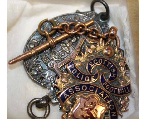 SCOTTISH POLICE FOOTBALL ASSOCIATION NINE CARAT GOLD MEDAL
won by R. Hutchison 1931-32, along with a Glasgow Police Athletic 