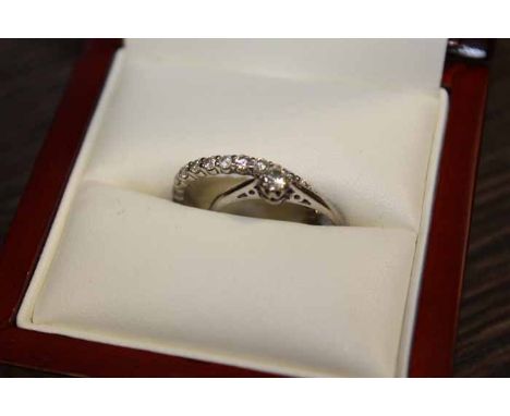 DIAMOND SOLITAIRE RING AND A DIAMOND ETERNITY RING
the solitaire with a brilliant cut diamond of approximately 0.15 carats, i