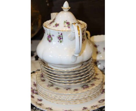 ROYAL ALBERT SWEET VIOLETS PATTERN TEA SET
comprising a tea pot, sugar, cream, cake plate, six cups, six saucers, six side pl