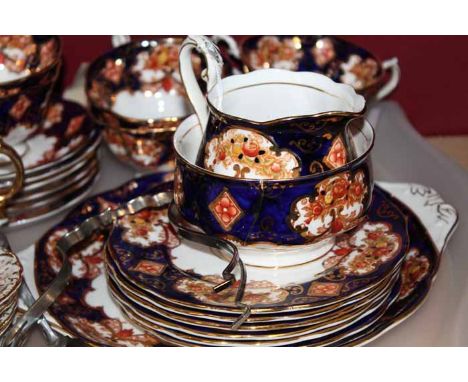 ROYAL ALBERT TEA SET
in blue, and brown floral pattern with gilt detail, six cups, saucers, side plates, sugar, cream and cak