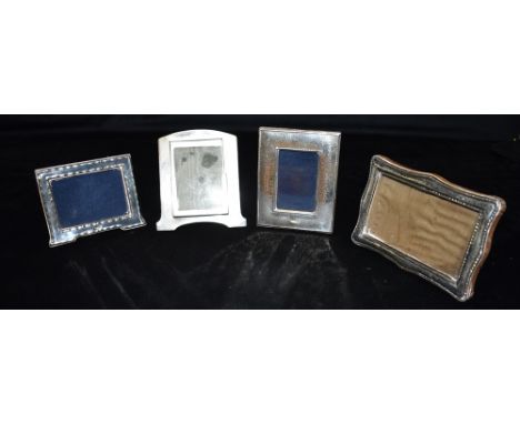 ASSORTED SILVER PICTURE FRAMES Four silver mounted rectangular frames, one Art Deco, hallmarked Birmingham 1923.  Largest app