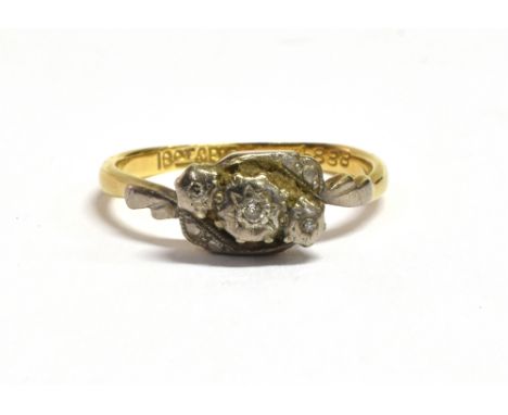 18CT GOLD &amp; DIAMOND RING Platinum overlaid, illusion setting three single cut diamonds, with wrap around shoulders and ye