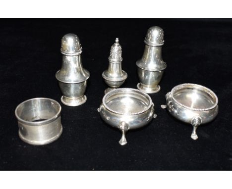 ASSORTED ANTIQUE SILVER CONDIMENT WARE To include a pair of pad foot salts (minus liners), a pair of salt and pepper shakers,