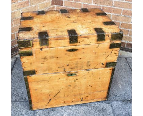 A RECTANGULAR METAL BOUND PINE TRUNK with pair of brass carrying handles and fall front cupboard under, height 65cm, width 63