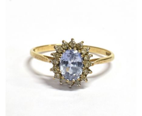 CEYLONESE SAPPHIRE &amp; DIAMOND RING Central oval mixed cut 'ceylonese' sapphire, estimated 1.5 carats, surrounded by round 