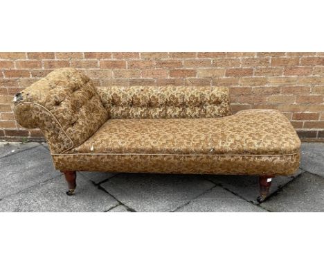 A VICTORIAN BUTTON UPHOLSTERED CHESTERFIELD TYPE CHAISE LONGUE  on spiral turned mahogany supports, 175cm long 68cm deep