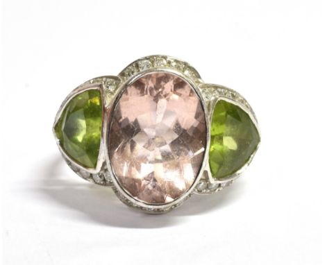 MORGANITE, PERIDOT &amp; DIAMOND RING Central bezel set morganite, estimated 4.36 carats, flanked by triangular cut peridots,