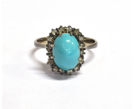 TURQUOISE &amp; DIAMOND RING Central oval turquoise cabochon, approx 10.7 x 7.0mm, surrounded by a halo of single cut diamond