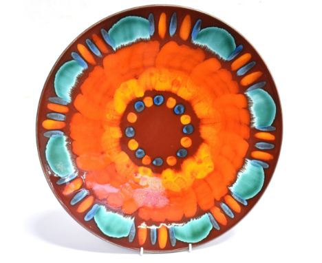 A LARGE POOLE POTTERY VOLCANO PATTERN CHARGER The charger measures 42cm in diameter and is in good condition. Stamped to the 